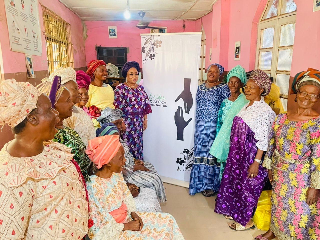 Widows gathered with the Bridge to Africa Foundation team at a local church community centre
