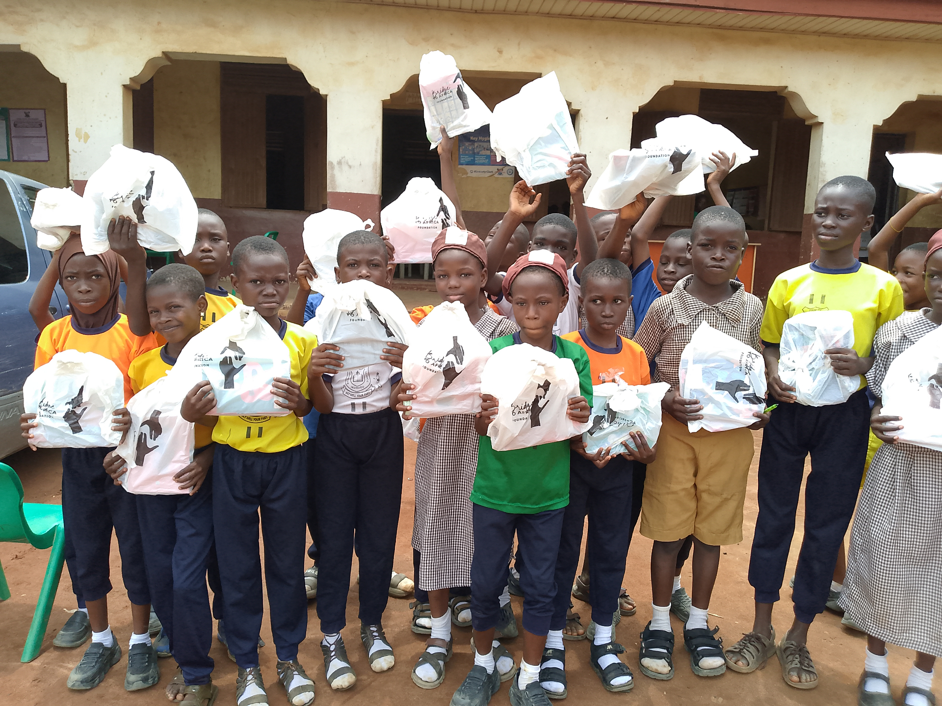 Pupils holding Bridge to Africa Foundation care packages