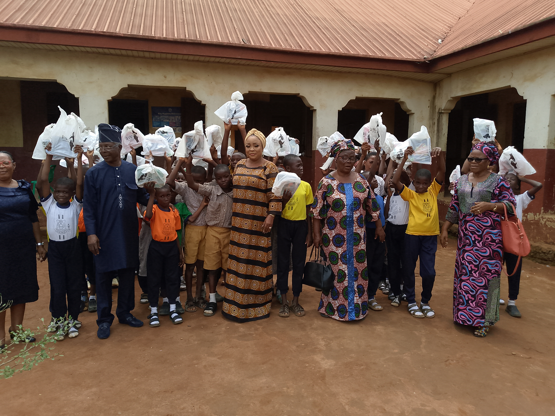 Foundation members with pupils holding care packages